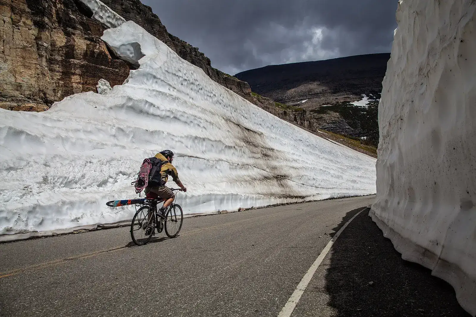 Cyclists on the Going-to-the-Sun Road beneath the Garden Wall, Glacier National Park