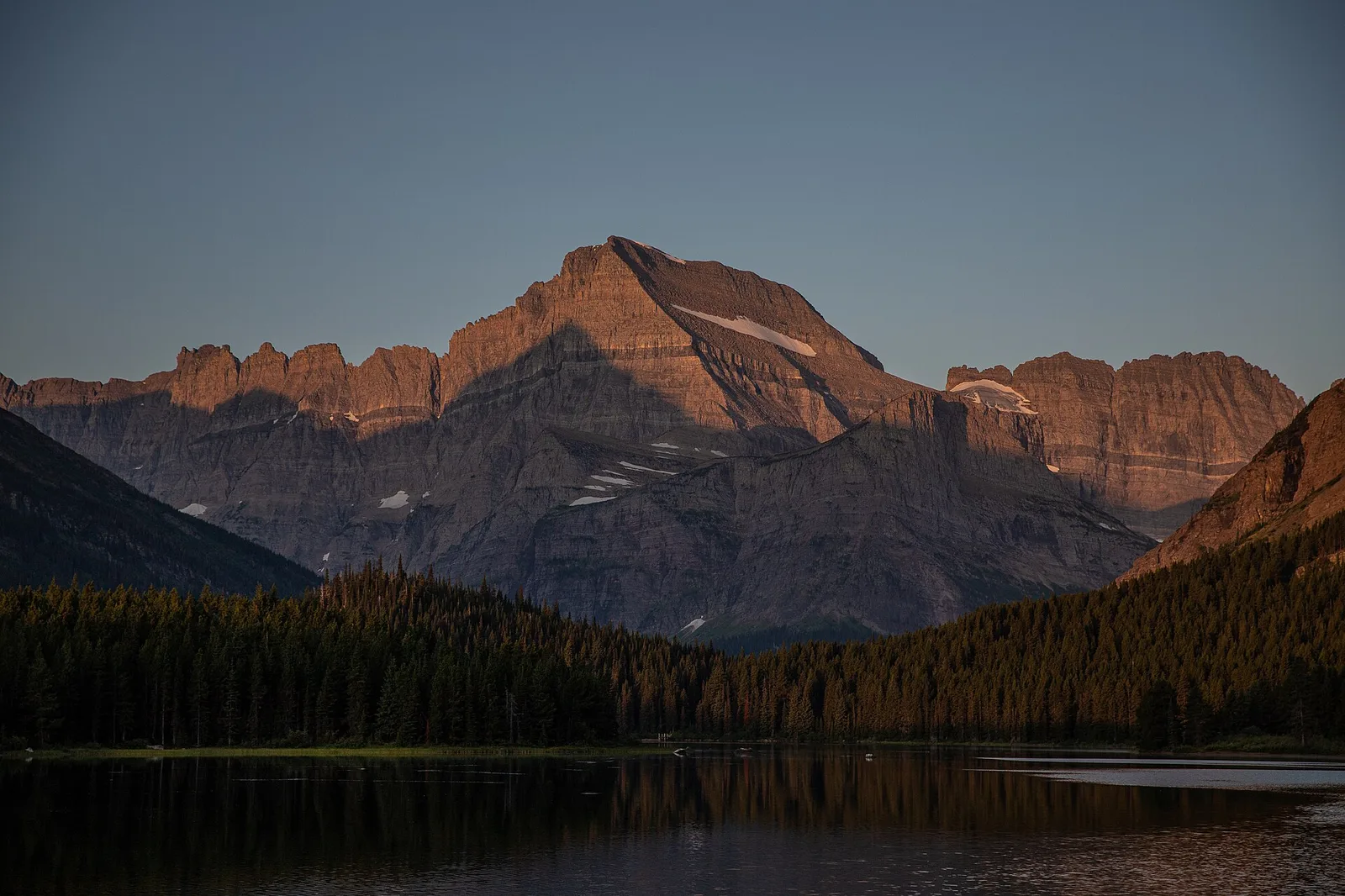 Sunrise over Swiftcurrent Lake and Mount Wilbur in the Many Glacier valley, Glacier National Park